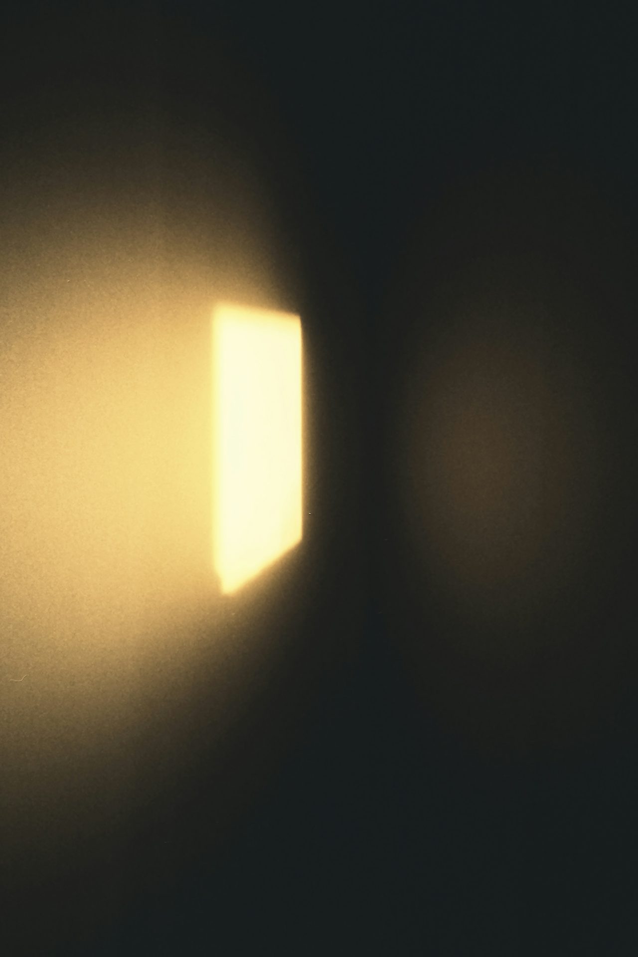 A patch of light on a dark wall
